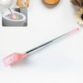 Top perspective of toilet cleaning brush with long handle for hygiene