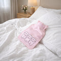 Mini hot and cold water bag lying flat on a surface showing compact size