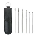The comprehensive ear wax cleaner kit displayed with its elegant black leather travel pouch.