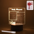 Acrylic decorative lamp featuring a heart shape, glowing softly in a bedroom setting.