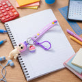 Front view of cute doll and cupcake keychain with rainbow strap accessory