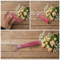Colorful silicone wrist strap keychain laid out on surface