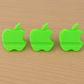 Assorted color apple-shaped mobile phone stands displayed together