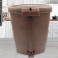 Sleek mini pedal dustbin discreetly positioned in an office workspace.