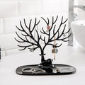 Side view of deer shaped jewellery holder showcasing antler branches and oval tray