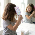 Children's hair care brush with comfortable handle