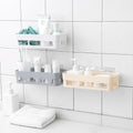 Wall-mounted shower shelf neatly holds toiletries in a bathroom corner.