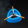 Side profile of plastic ashtray highlighting its depth and cigarette rests