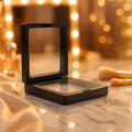 Close-up of membranes suspending jewelry in floating display box