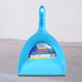 Durable plastic dustpan in action, showcasing its wide mouth for effective cleaning.