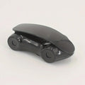 Stylish red sports car phone holder positioned on a car dashboard.