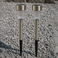 Weatherproof solar path light standing in a garden with green foliage