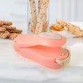 Mini heat sealer conveniently attached to a refrigerator with its magnetic back.