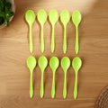 Several lightweight plastic spoons stacked, showing their compact and space-saving design.