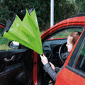 Kids UV umbrella open in an outdoor setting, ready for use.
