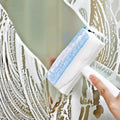 Overview of the 2-in-1 glass cleaner and brush, highlighting its dual functionality.
