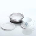 Durable plastic coasters effectively protecting a wooden surface from drink stains.