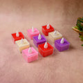 Close-up of multicolor square LED tealight candle showing flickering flame effect