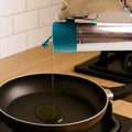 Handled stainless steel oil dispenser designed for drip-free pouring