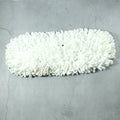 Freshly washed dust mop refill head drying naturally.