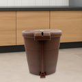 Side view of a white mini pedal dustbin, highlighting its convenient foot pedal.
