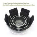 Pots and pans stacked with felt protectors between to avoid scratches and damage