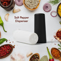 Elegant polycarbonate salt and pepper dispensers on a modern dining table.