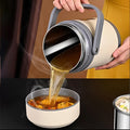 Open portable food warmer showing its spacious 2L capacity and removable liner.