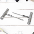 Tyre repair kit tools shown in hand for scale and easy handling.