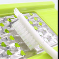Kitchen cleaning brush with white handle and bristles