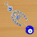 Handcrafted evil eye wall hanging featuring beads and tinkling chime