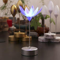 The decorative lotus lamp illuminating a room, creating a peaceful and inviting atmosphere.
