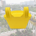Hanging plastic planter displayed to show its suitable size for various plants.