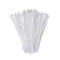 A hand holding flexible black self-locking cable ties, demonstrating their durability.