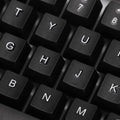 Angled view of the wired keyboard, highlighting its full-size layout and ergonomic key placement.