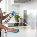 Kitchen cleaner spray removing grease and tough stains on stove