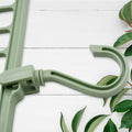 Durable plastic multi-hole hanger displaying its non-slip design for clothes organization.