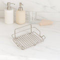 Soap holder tray in a clean bathroom setting with stainless steel build