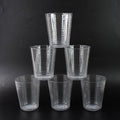 Crystal-clear Plastic Ringo Glass filled with chilled beverage on table