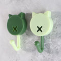 Close-up of beige round self adhesive stick-on wall hooks