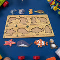 Detailed view of the smooth, child-safe wooden pieces of the sea animal puzzle.