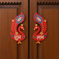 Close-up of traditional Shubh Labh wooden wall hanging design