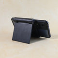 Side view of sleek black plastic foldable desktop mobile stand