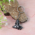Metal keychain displaying detailed Shiva face and metal attachments
