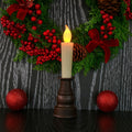 Close-up of premium decorative LED candle flame and classic holder