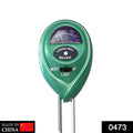 Close-up of green plant moisture sensor displaying pH, light, and moisture levels.