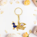 Decorative Krishna keychain featuring peacock motif with enamel detailing