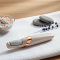 Electronic pedicure tool charging via USB, highlighting its convenient rechargeable feature.