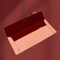 Open view of a wedding gift envelope showing space for Indian currency notes.