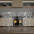 Side view of pyramid plastic glass showcasing wide stable base